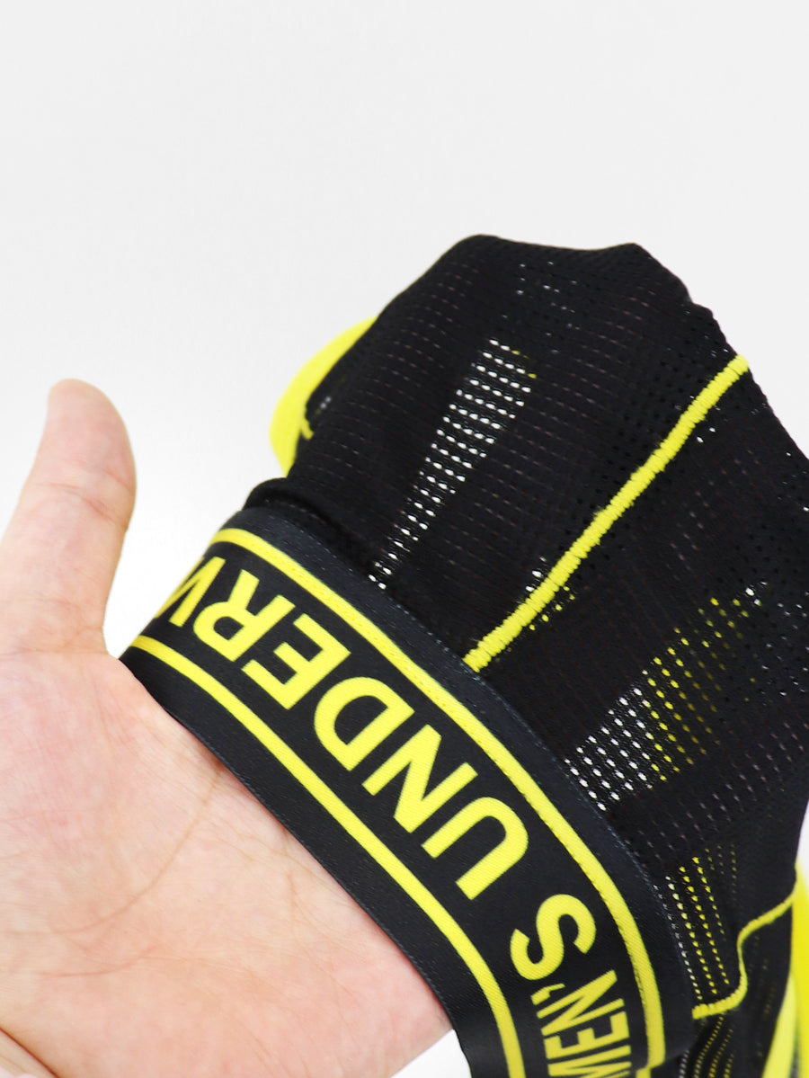 Black mid-rise men's jockstrap underwear featuring bold yellow trim and patterned waistband.