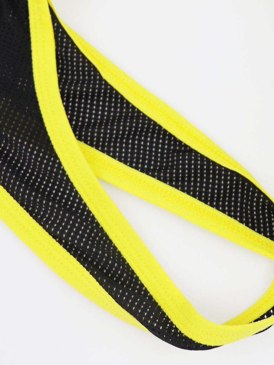 Black mid-rise men's jockstrap underwear featuring bold yellow trim and patterned waistband.