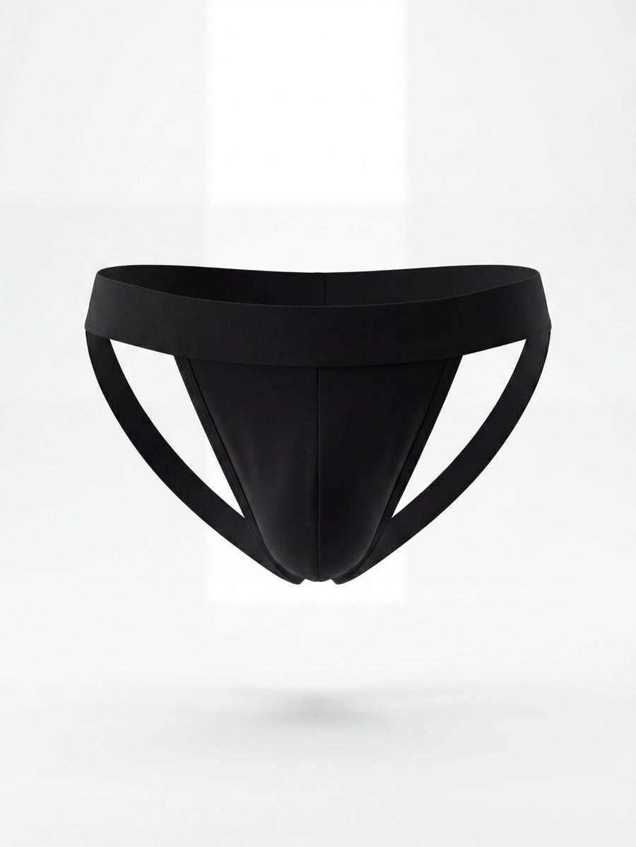 Men's black solid color jockstrap featuring a cut-out back design, tape detailing, and mid-rise waist crafted from medium-stretch knitted fabric.
