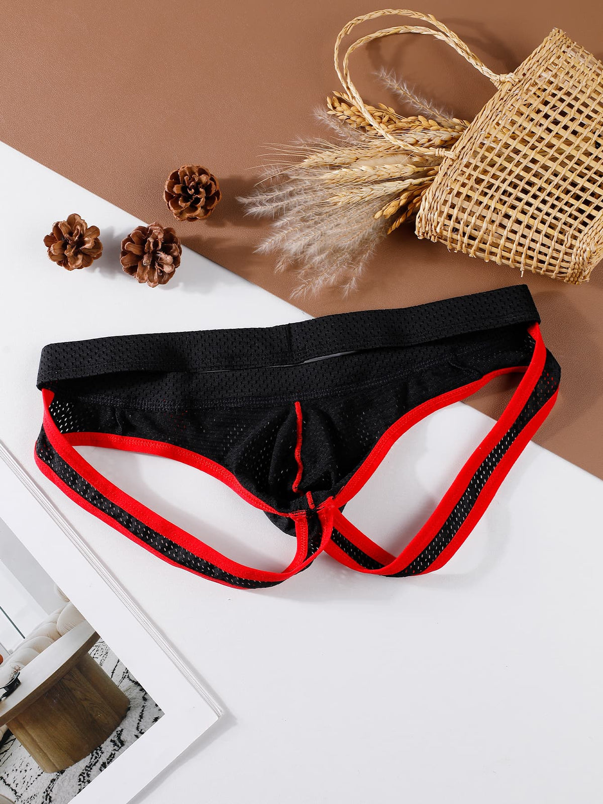 Black low rise men's contrast color thong with V neck and Christmas pattern design.