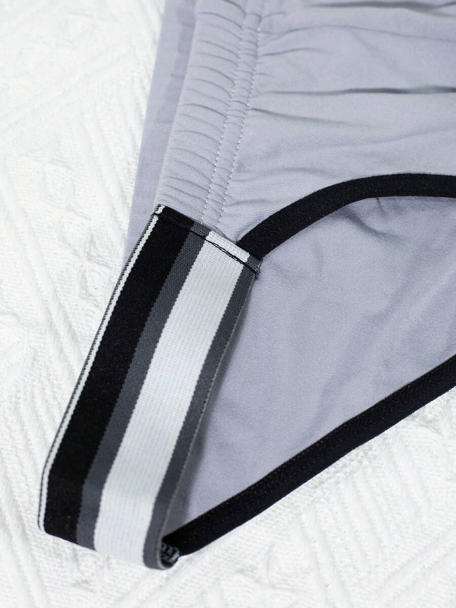 3-pack set of men's high-cut briefs featuring colorblock and plaid patterns with a striped waistband and mid-rise fit.