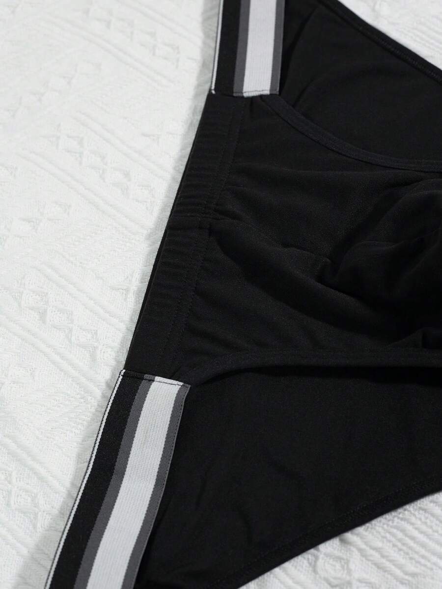 3-pack set of men's high-cut briefs featuring colorblock and plaid patterns with a striped waistband and mid-rise fit.