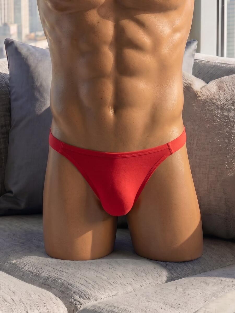 Men's low rise hollow jockstrap underwear crafted from solid black medium stretch knitted fabric.