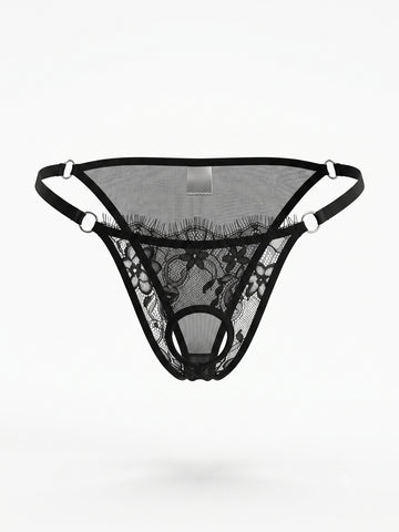 Men's black lace low rise thong featuring sheer plant pattern fabric and metal decor.