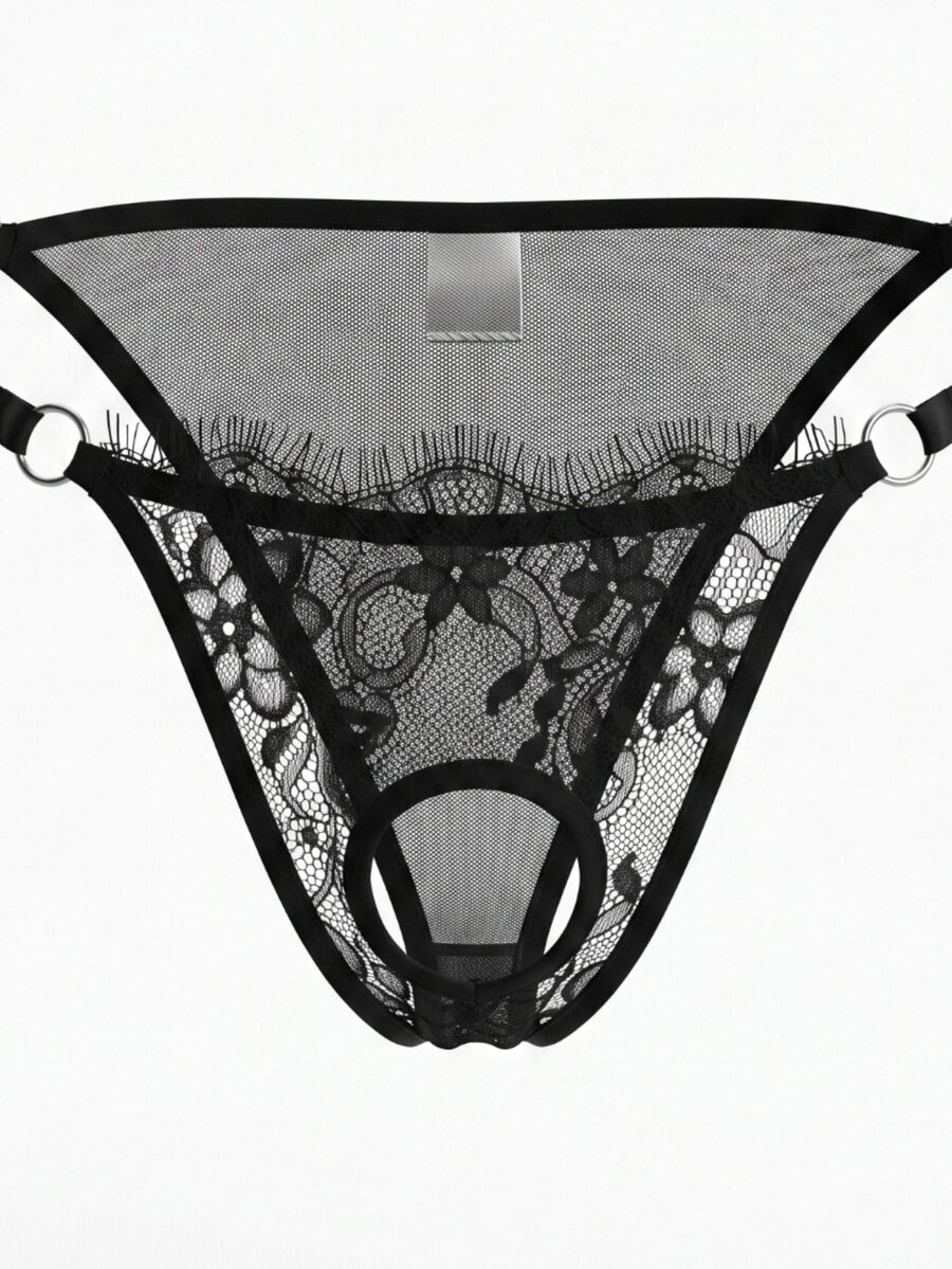 Men's black lace low rise thong featuring sheer plant pattern fabric and metal decor.
